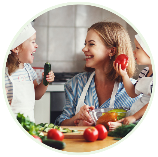 Healthy eating. Happy family mother and children prepares  vegetable salad